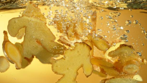 istock Freeze Motion of Ginger Slices Falling into Water. 2184713172