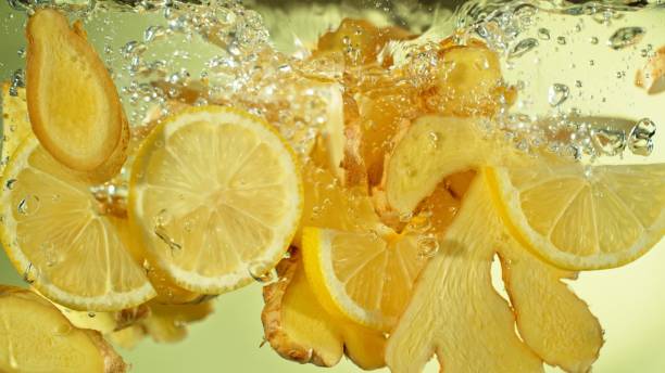 istock Freeze Motion of Ginger and Lemon Slices Falling into Water. 2184713200