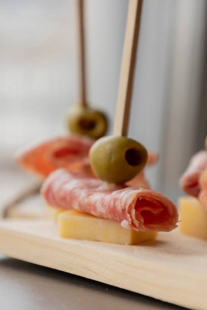 istock Appetizers with Cheddar, Salami, and Green Olives 2184714291