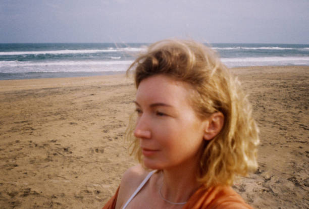 istock portrait woman on the ocean shore 2184715791