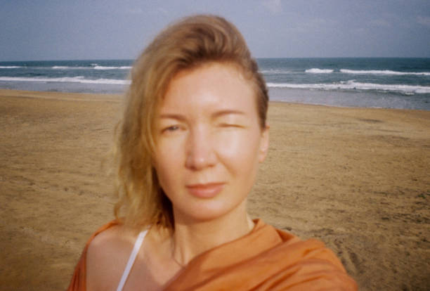 istock portrait woman on the ocean shore 2184715794