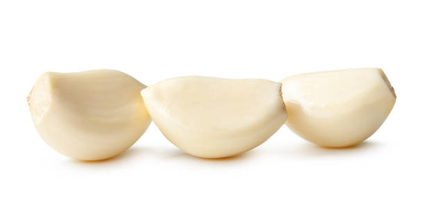 istock Side view of peeled garlic cloves in stack isolated on white background with clipping path 2184719015
