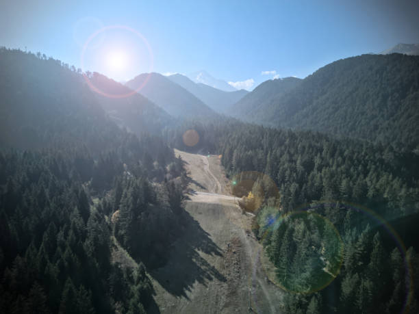 istock Mountain sun flare landscape 2184722592