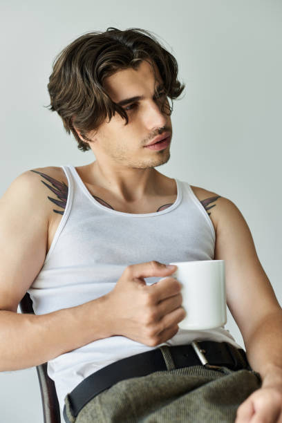 istock A handsome young man reflects in a stylish studio on a casual afternoon 2184723372