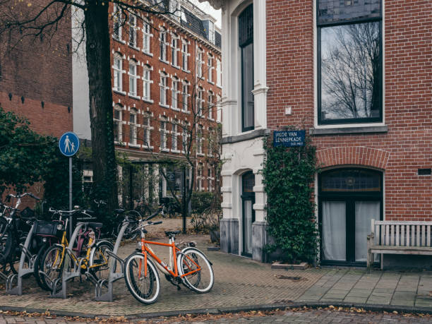 Amsterdam, The Netherlands - 12 14 2023: Parked bicycles on a street in Amsterdam
