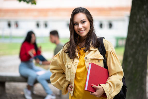 istock Young student smiling at the camera at university campus 2184725668