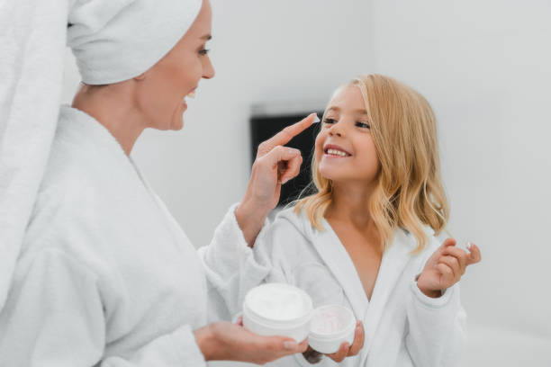 istock A mother and daughter joyfully share a bedtime self-care routine in the bathroom 2184727609