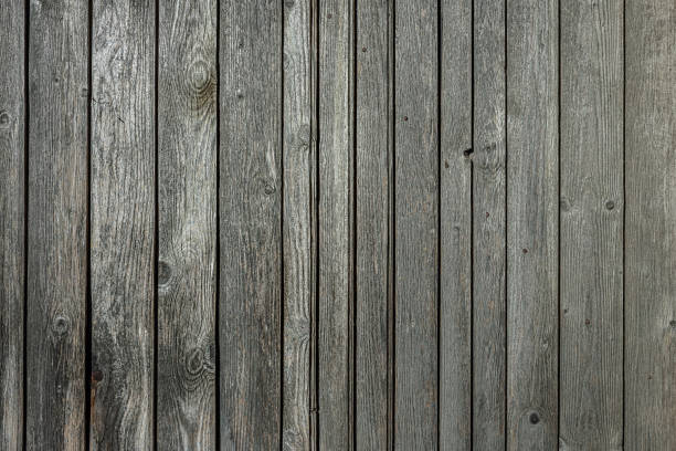 Fence made of stacked wooden boards.