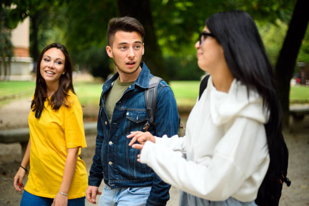 istock University students walking and talking together on campus 2184728679