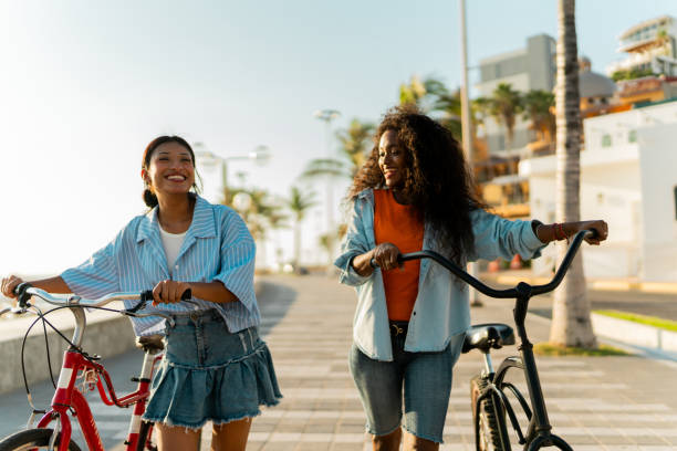 istock Young friends riding bicycles outdoors 2184729604