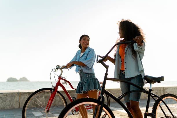 istock Young friends riding bicycles outdoors 2184729609