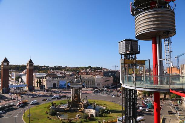 People visit terrace overlooking Placa d'Espanya city square in Barcelona.