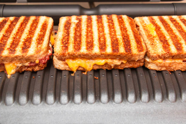 Delicious grilled sandwiches made from multigrain sandwich bread on an electric BBQ grill.