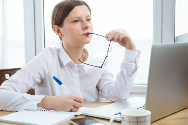 istock Woman dreaming at working place, planing holidays. Designer thinking how to make new project. 2184736004