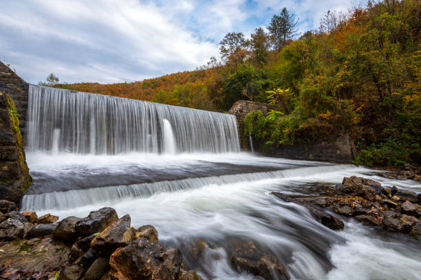 istock Waterfall on river weir in autumn 2184737177