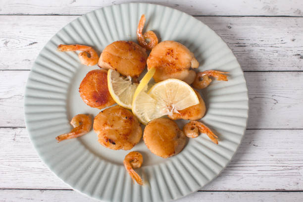 fried scallops on a plate, seafood. Serving dishes in the restaurant