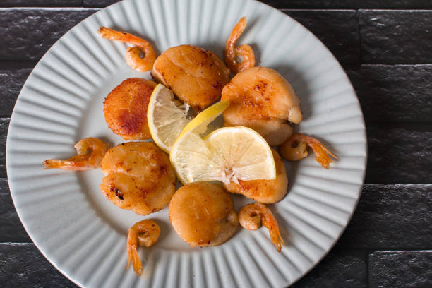fried scallops on a plate, seafood. Serving dishes in the restaurant
