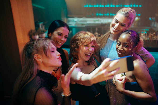 istock Five female friends on a video call during their night out 2184744933