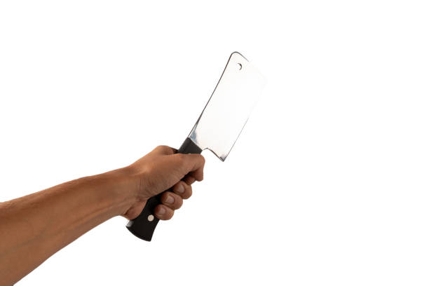 Hand holding a butcher knife isolated on white background. High quality photo
