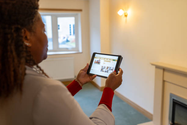 istock Estate Agent Looking at Property Listings on a Digital Tablet 2184748659