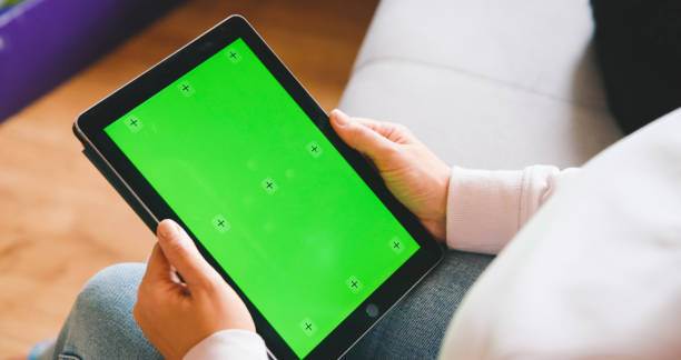 istock Caucasian Woman Engaging with Tablet on Sofa 2184756490