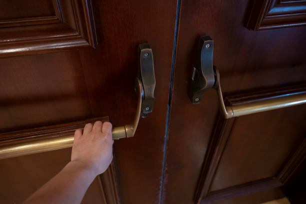 istock Hand pulled brown vintage wooden door metal handle 2184758129