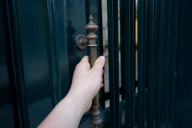 Manually pull the handle of the wooden door
