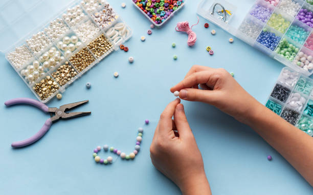 istock Creating colorful beaded jewelry with vibrant materials on a crafting table 2184759225