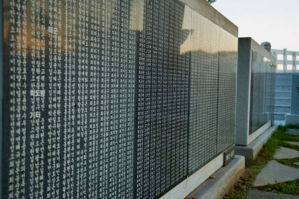Gangneung, South Korea - November 3rd, 2024: The solemn memorial wall at Gyeongpodae Chunghon Tower bears the names of Korean War soldiers from Gangneung, honoring their sacrifice and patriotic spirit.