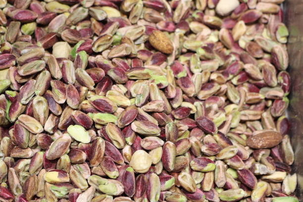 istock Enjoy the Vibrant and Flavorful Pistachio Nuts Displayed in a Beautiful Rustic Setting 2184760984