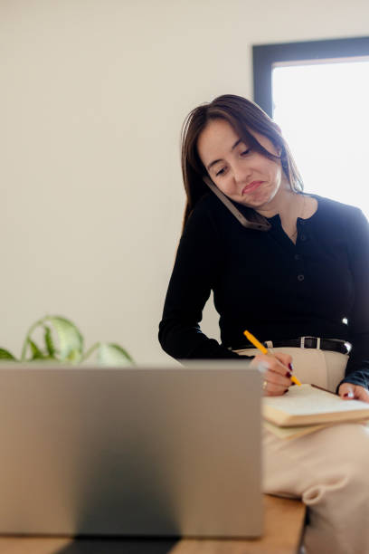 istock Distance Education. E-learning, Study online, Smiling beautiful woman sitting at desk and wearing headphone head set study online class zoom google meet discord, Happy engaged girl attending for learn 2184762468