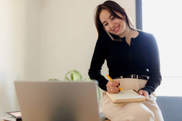 istock Distance Education. E-learning, Study online, Smiling beautiful woman sitting at desk and wearing headphone head set study online class zoom google meet discord, Happy engaged girl attending for learn 2184762828