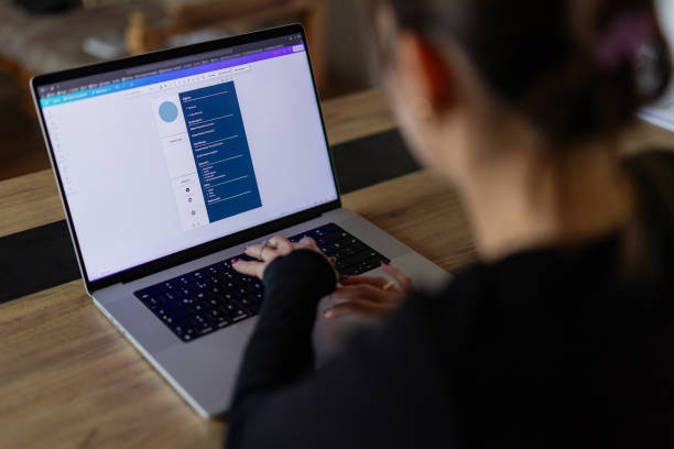 istock Woman creating her CV on computer. All contents in document are made up 2184763011