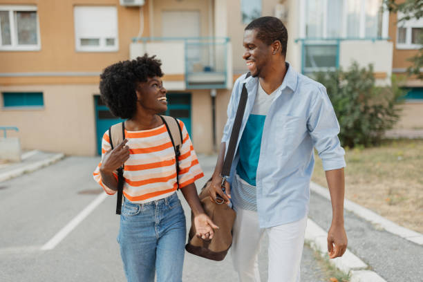 istock Couple walks joyfully with bags and backpacks on 2184765165