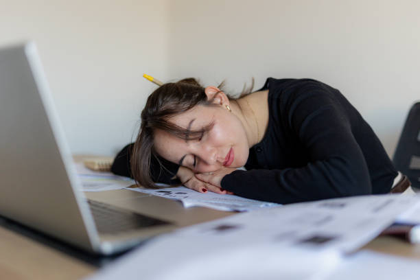 istock Tired Woman Working Extra Hours at The Office 2184765492
