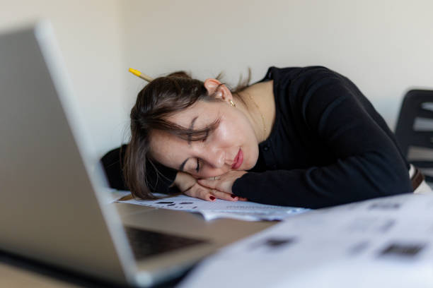 istock Tired Woman Working Extra Hours at The Office 2184765536