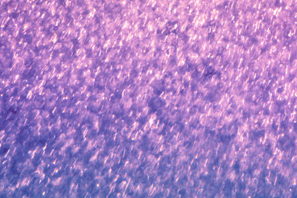 Blue-purple glitter abstract background of blurred shiny lights