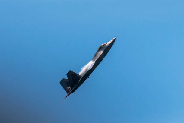 F-15 Fighter Jet flying at sunset