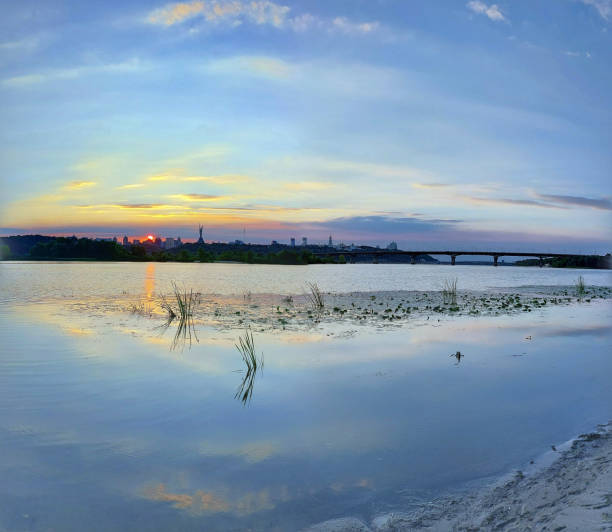 istock Tranquil Sunset over the Dnipro River with Kyiv’s Skyline and Bridge Reflections 2184768707