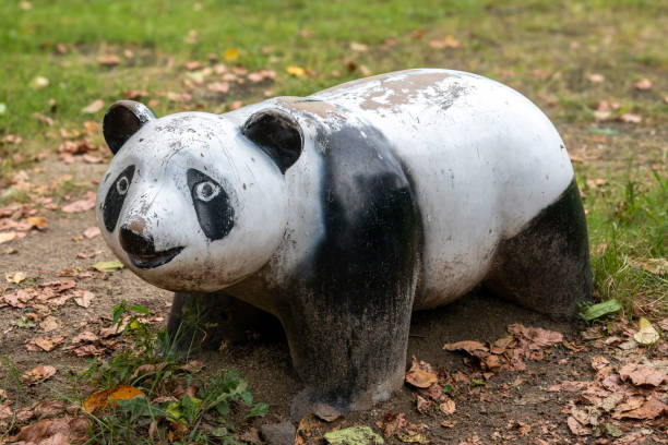 istock Weathered panda statue rests in kyoto park, japan 2184769982