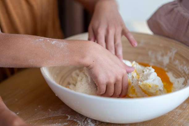 istock close up of children's hands kneading dough 2184770001