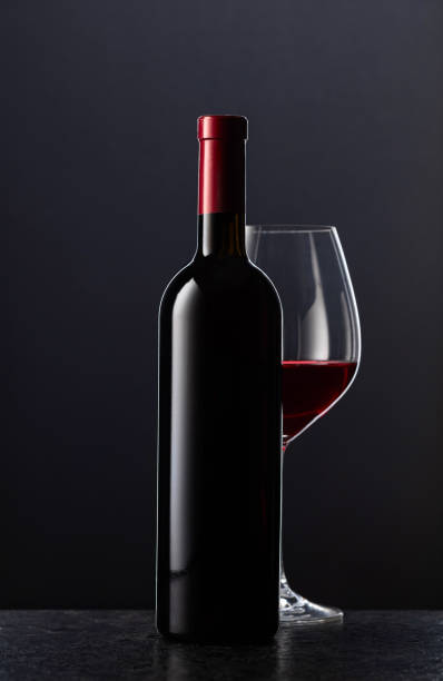 istock Bottle and glass of red wine. 2184770474