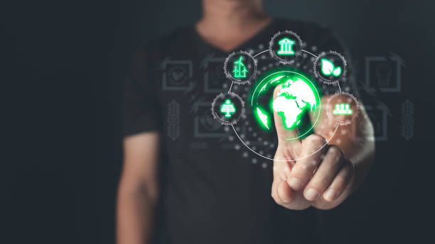 istock hand touch hologram to save energy,and reduce global warming,climate change,ecology friendly investment,ESG environment social governance,Green Business Innovation and Sustainable Development concept. 2184772588