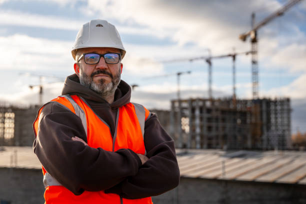 istock Construction Worker in Safety Gear at Building Site 2184773166