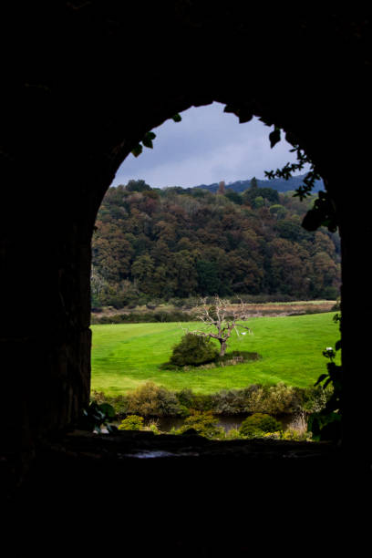 istock Looking through a window from a medieval ruin at the Welsh countryside. 2184777660