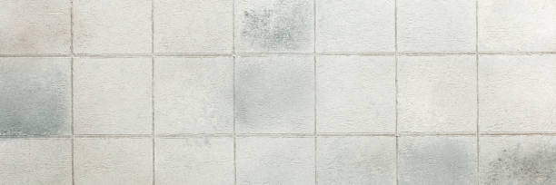 istock Gray tiles create a sleek and glossy background, adding depth and sophistication to any interior or design project 2184779010