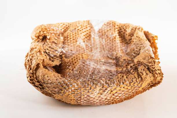 istock A textured view of crumpled packaging foam, showcasing its unique patterns and folds against a clean white background. 2184784526