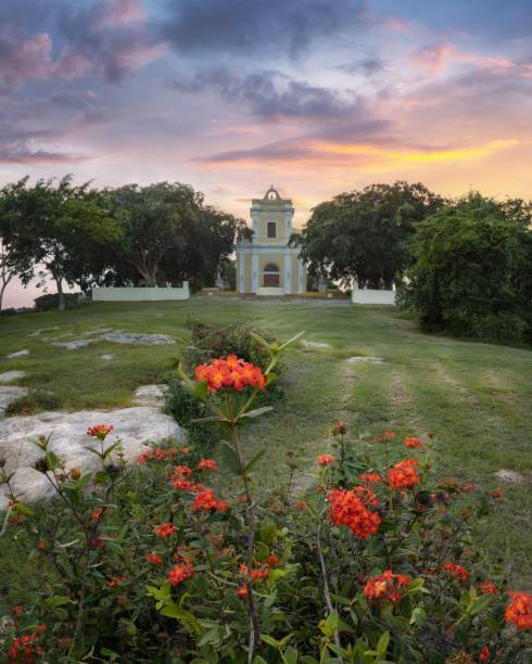 istock Chapel amidst lush greenery and sunset sky. 2184784611