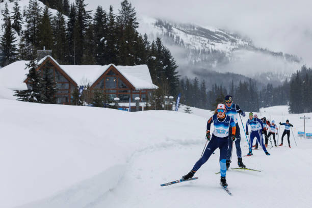 A group of women compete in a mass start cross-country ski race at Panorama Mountain Village in British Columbia, Canada. They are doing the skate-ski technique. (John Gibson Photo / GibsonPictures)