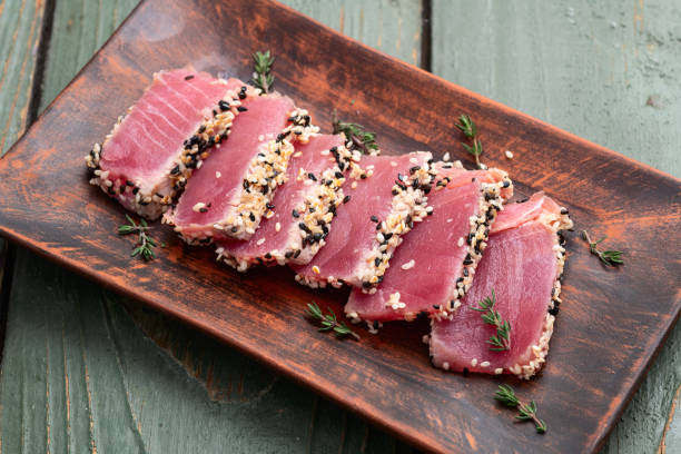 istock Sliced tuna steak with sesame photography . Top view 2184789784